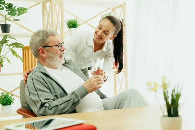 Man receives holistic wellness care from provider, including mobile IV treatment